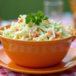 Delicious and colorful coleslaw ready to serve at a summer picnic.