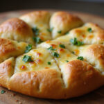 Delicious baked garlic cheese bread with fresh parsley, a unique twist on Cunetto's classic.