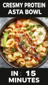 A close-up of a creamy pasta bowl topped with tender chicken pieces, garnished with fresh herbs and a drizzle of sauce, presented on a rustic plate with steam rising, conveying warmth and comfort.